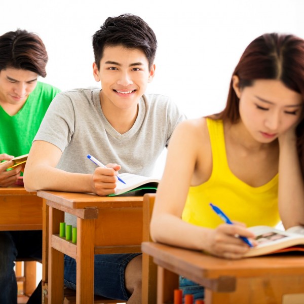 Uninversity students taking an exam in a classroom