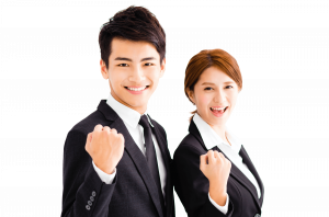 Business man and woman fist pumping with motivation